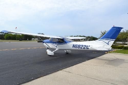 Cessna 172 Skyhawk aircraft N6822M parked on the tarmac with a blue and white paint scheme.