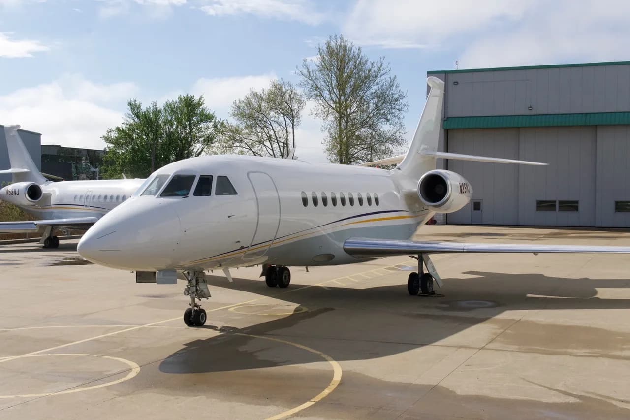 Front view of the aircraft N26NJ parked on the tarmac.