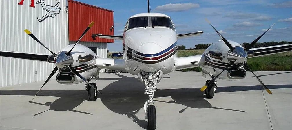Front view of a King Air C90B aircraft on the ground.