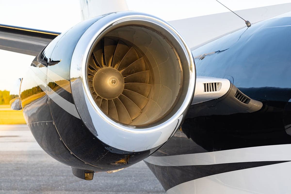 Close-up of the aircraft's engine with a chrome finish.
