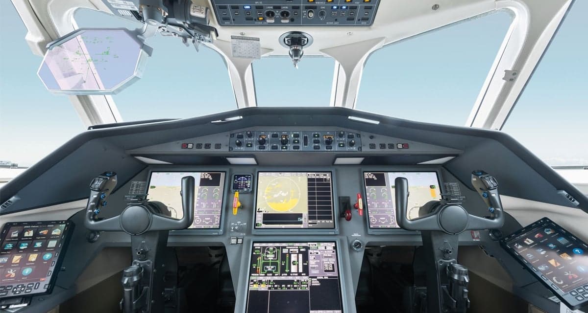 Aircraft cockpit with multiple display screens.