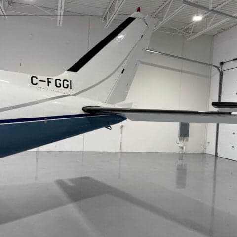 Close-up of the tail of a Piper PA-31 Navajo with the registration C-FGGI.