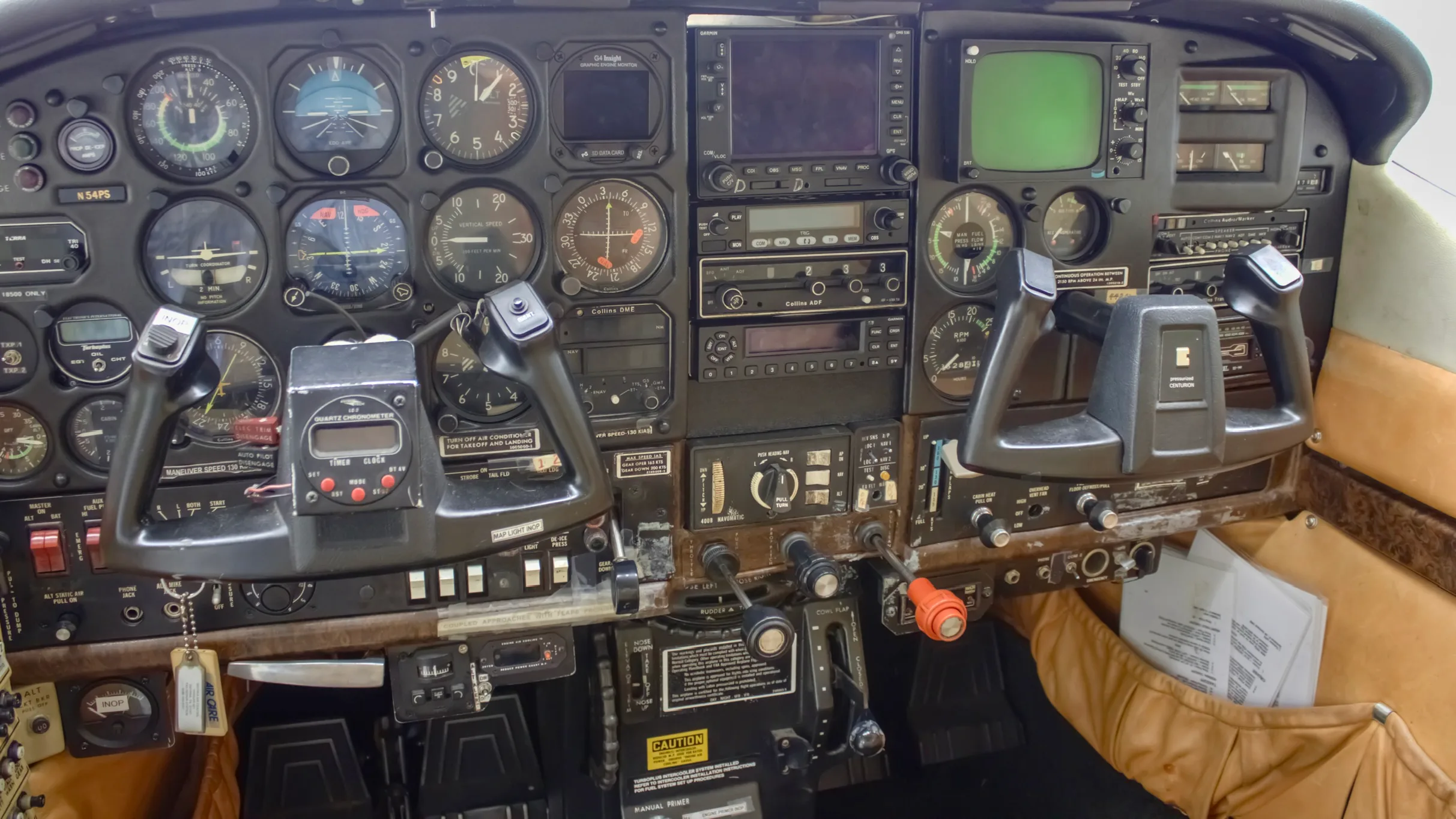 The cockpit of the Cessna P210N Centurion, showing the instrument panel with various gauges and two control yokes.