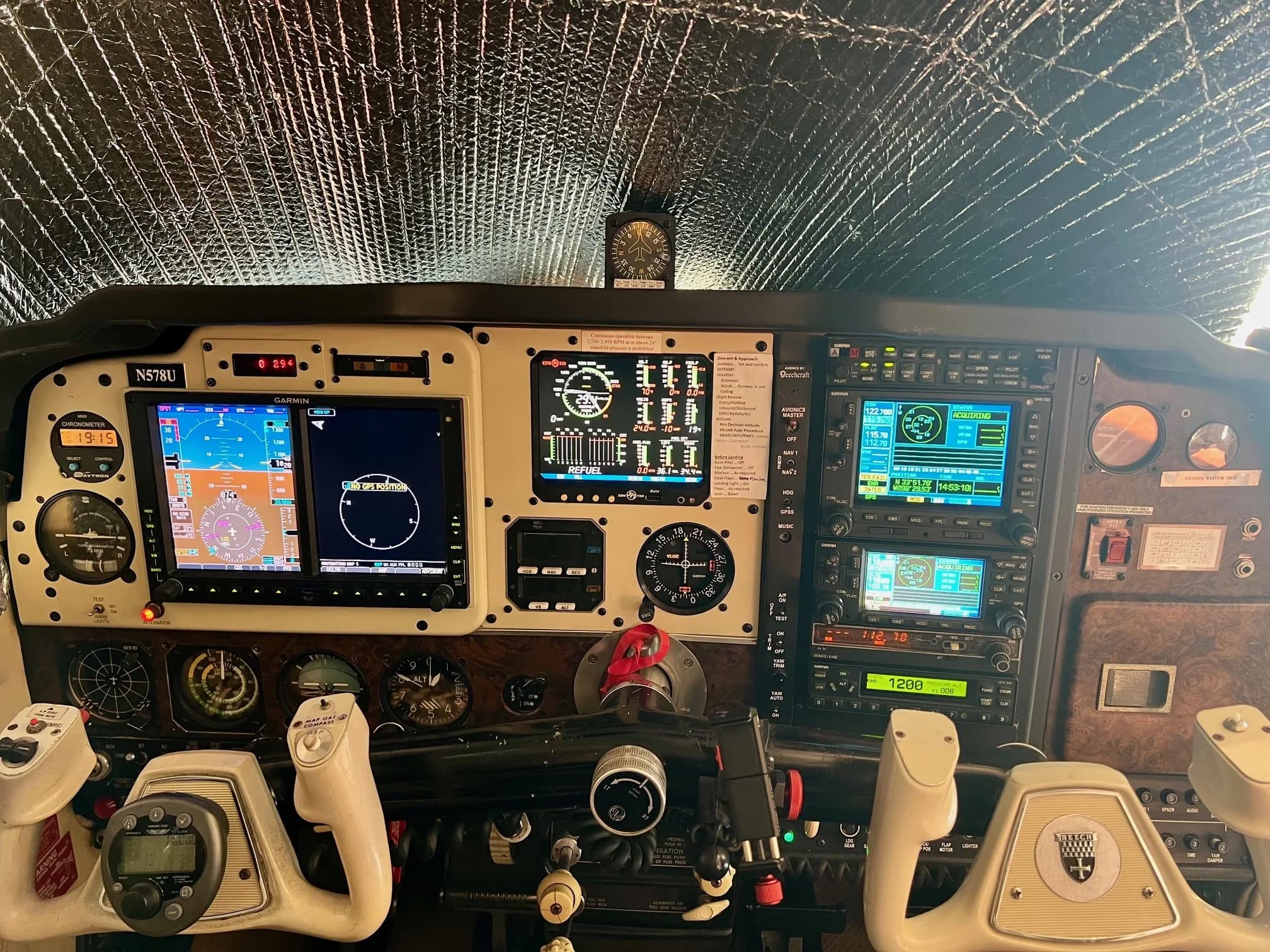 Full view of the aircraft's cockpit, including the instrument panel and avionics.