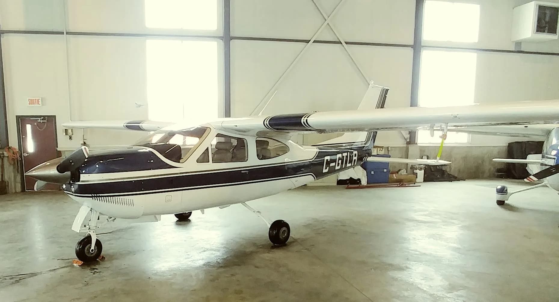 Cessna C-GTLR parked inside a hangar.