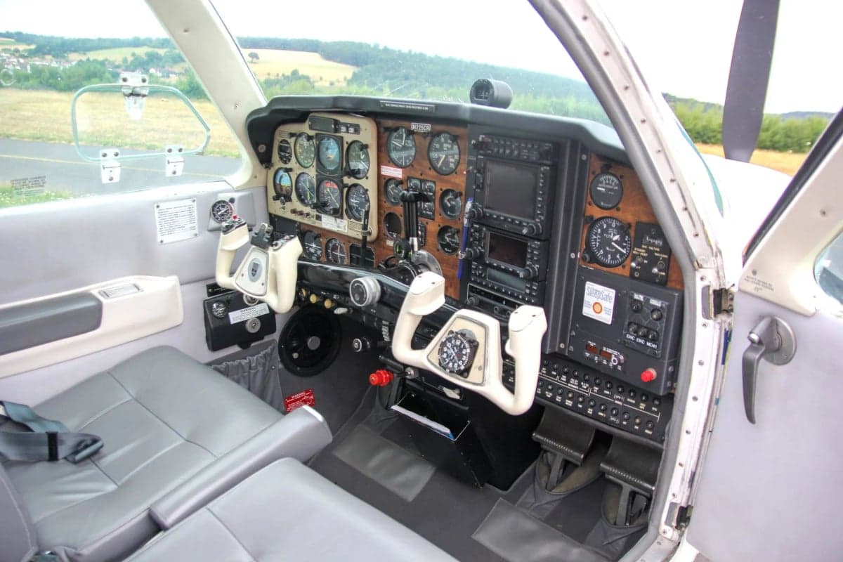 View of the cockpit of the Beechcraft Bonanza, showing the instrument panel and controls.