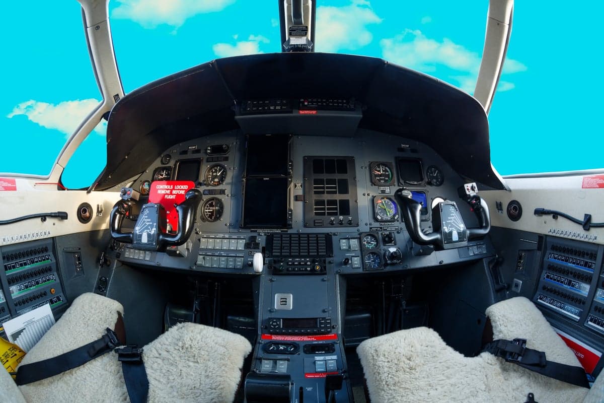 View of the aircraft cockpit instrument panel and controls.