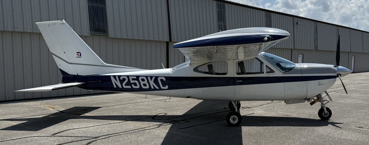 Side view of the N258KC Cessna aircraft on the ground.