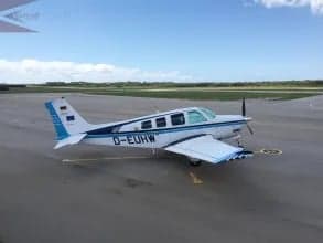 Side view of the D-EUHW aircraft parked on the tarmac.