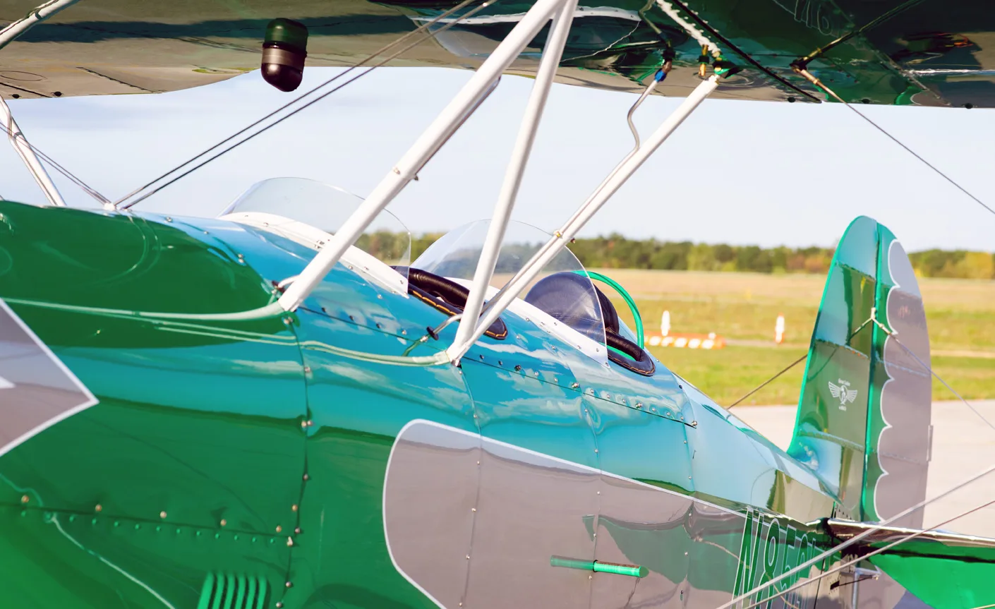 Close-up of the biplane's cockpit area and tail section.