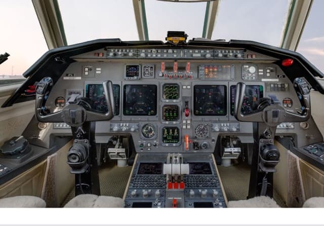 The cockpit of the Falcon jet, showing the instrument panel and controls.