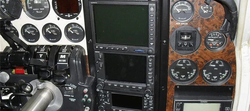 Aircraft cockpit with Garmin avionics and engine gauges.