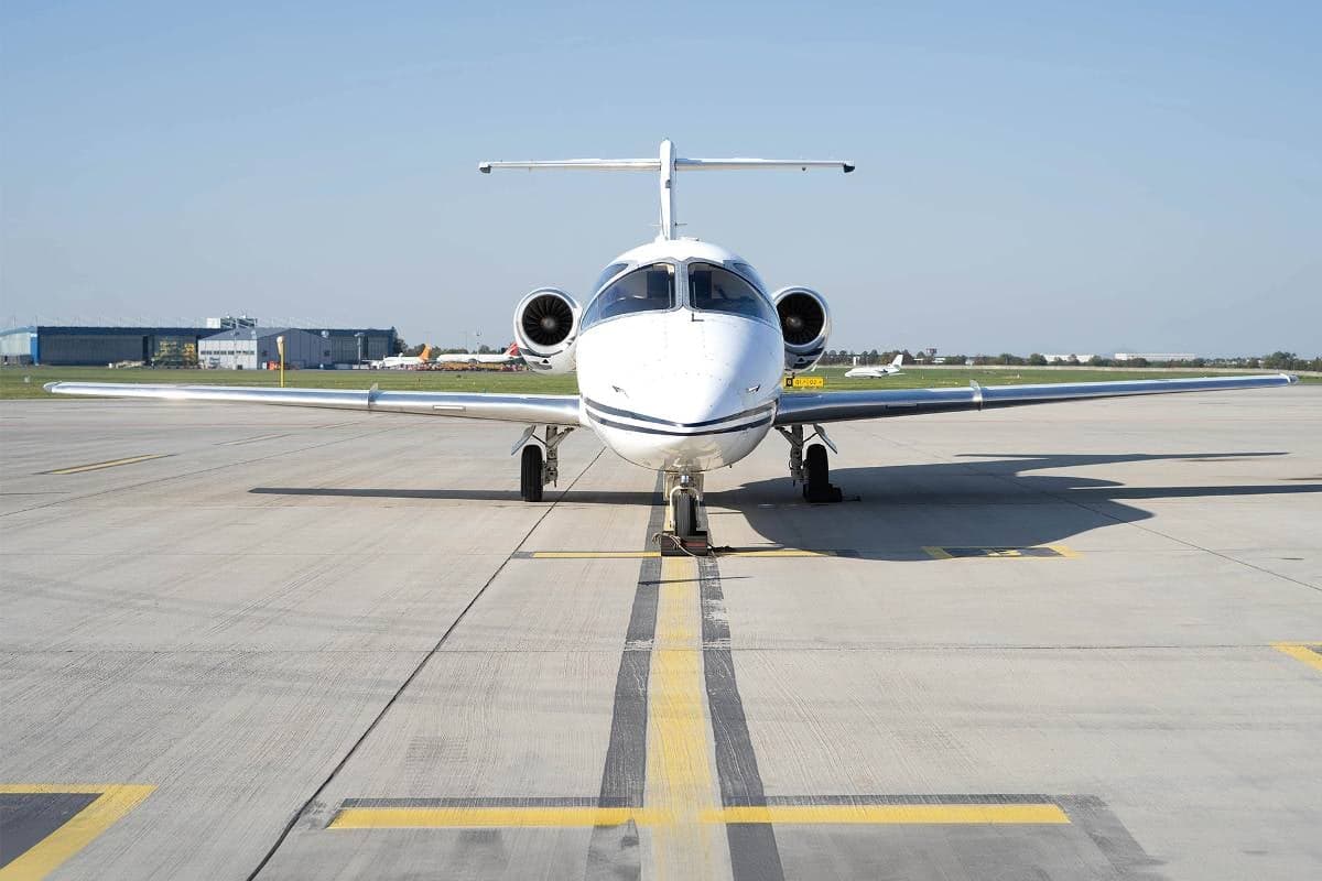 Front view of a Beechcraft Beechjet 400A aircraft on the tarmac.