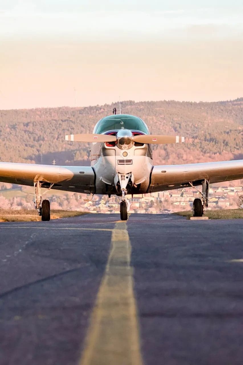 Close up front view of Beechcraft Bonanza N8918M on the runway.