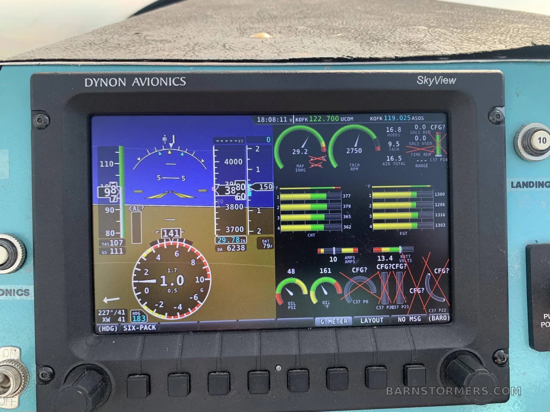 A close-up view of a Dynon Avionics SkyView display showing flight instruments, engine parameters, and navigation information.