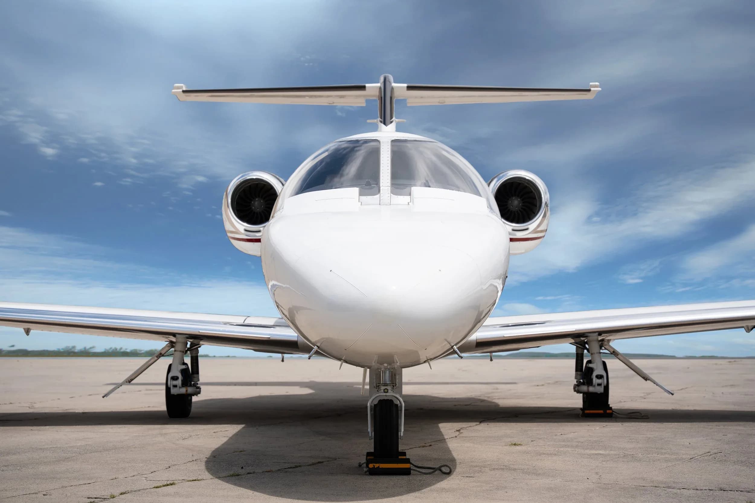 Front view of a Cessna Citation M2 aircraft on the ground.