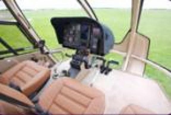 View of the cockpit with instrument panel and seats.