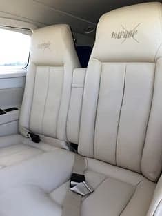 Interior view of the Piper M600 cabin showing the side panels and seats.