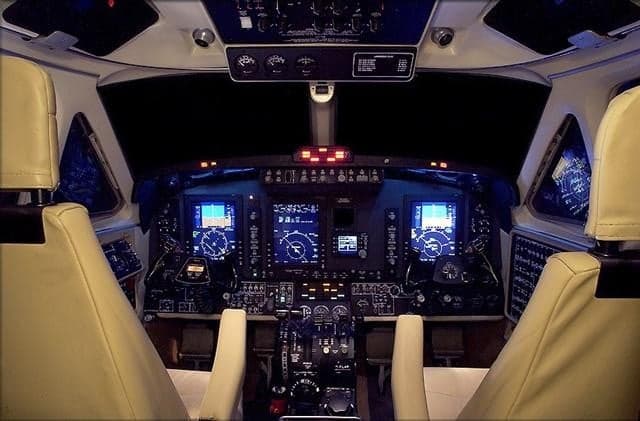 King Air cockpit with modern avionics and beige seats.