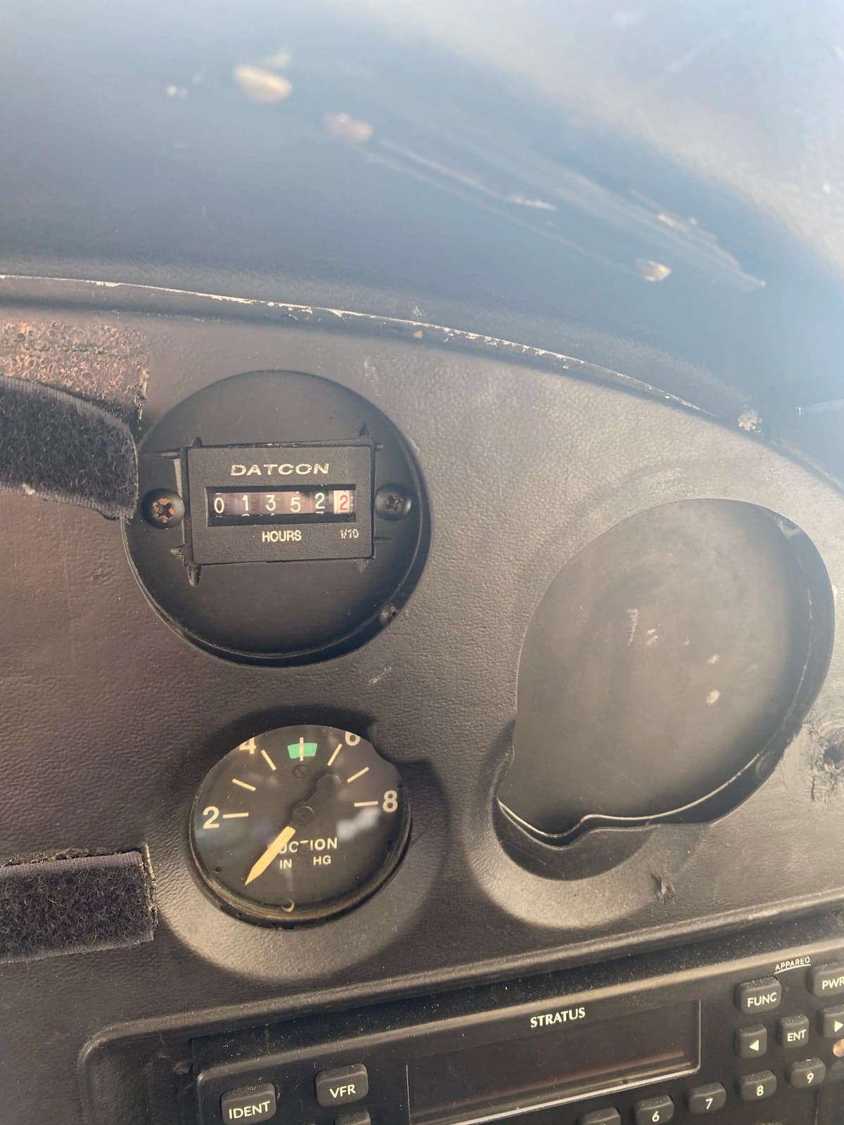 Close-up of the aircraft's Hobbs meter and other instruments.