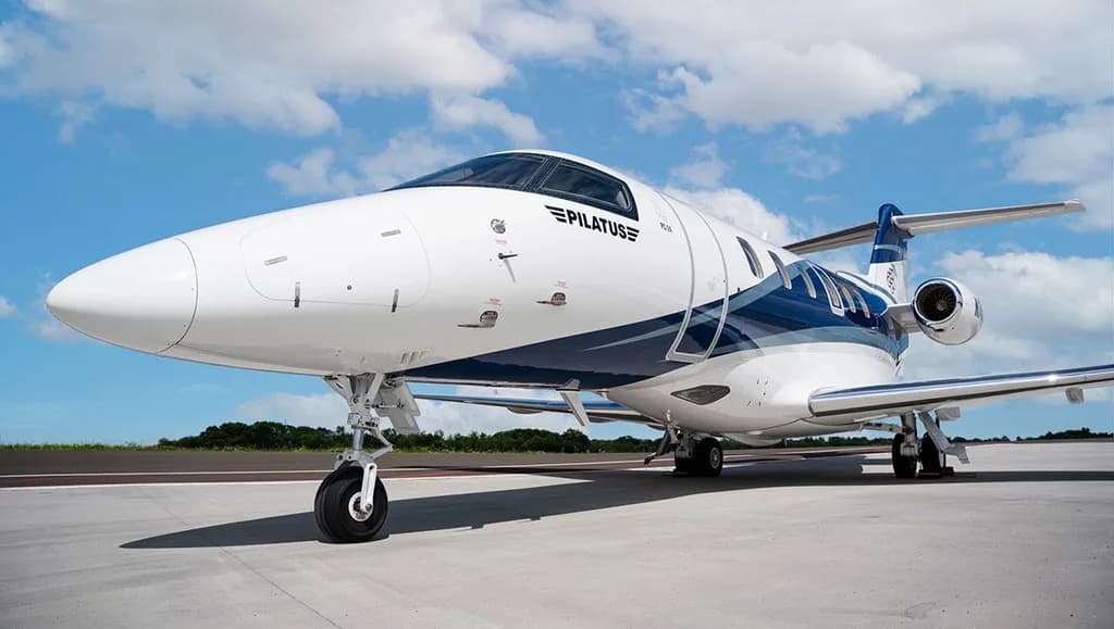 A front-quarter view of the Pilatus PC-24 business jet, registration N74JX, parked on an airfield.