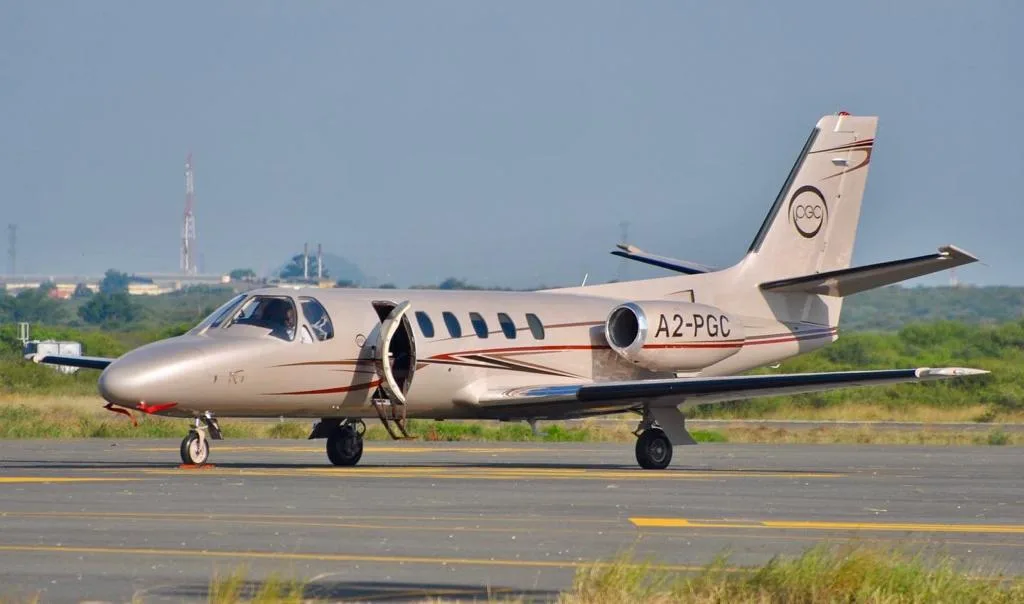 A2-PGC Cessna Citation Mustang on the tarmac with the door open.