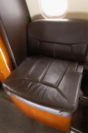 Close-up of a leather seat in the Learjet 45XR cabin.
