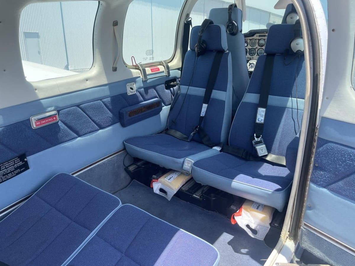 View of the aircraft's blue cloth seats and interior.