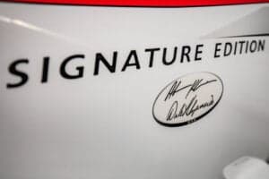 Close-up of the 'Signature Edition' logo on the Cirrus SR22 aircraft.