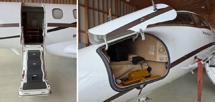 Phenom 300 aircraft with open entry stairs and baggage compartment.