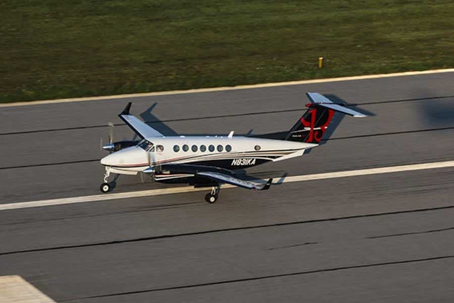 A King Air aircraft on the runway.