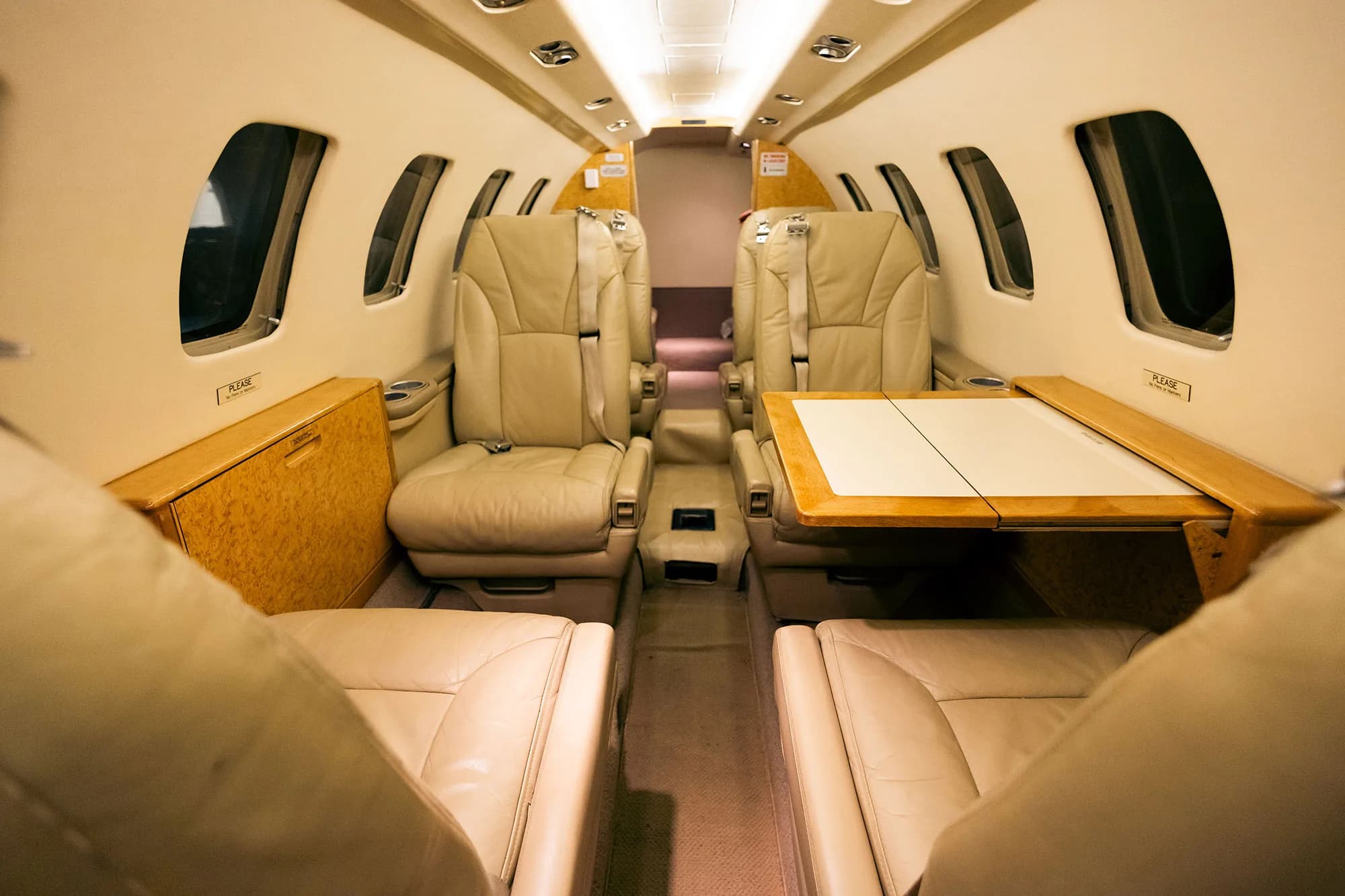 View of the Cessna Citation CJ1+ cabin seats with table.