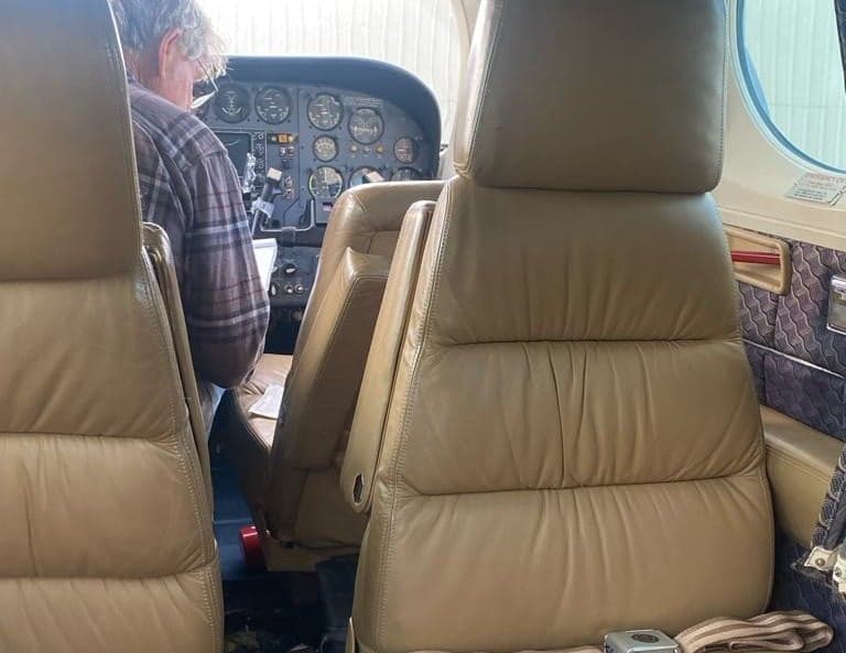 View of the cabin seats and cockpit of the aircraft.