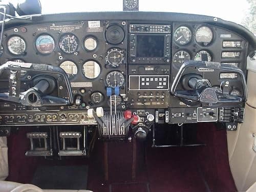 The cockpit of the aircraft features a full instrument panel and dual yokes.