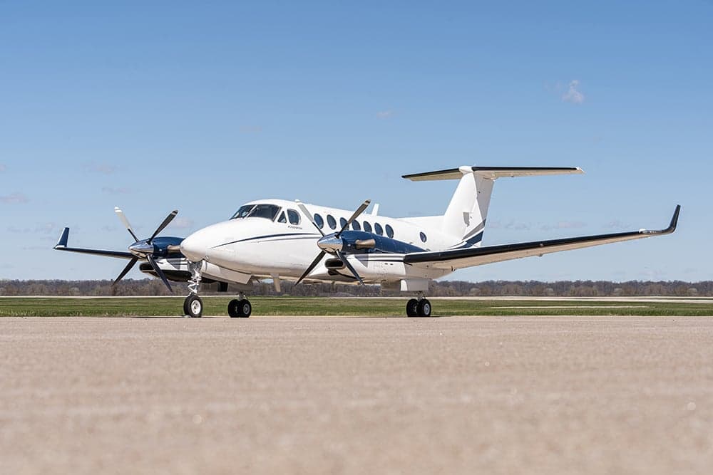 Beechcraft King Air 350i aircraft on the ground, side view.