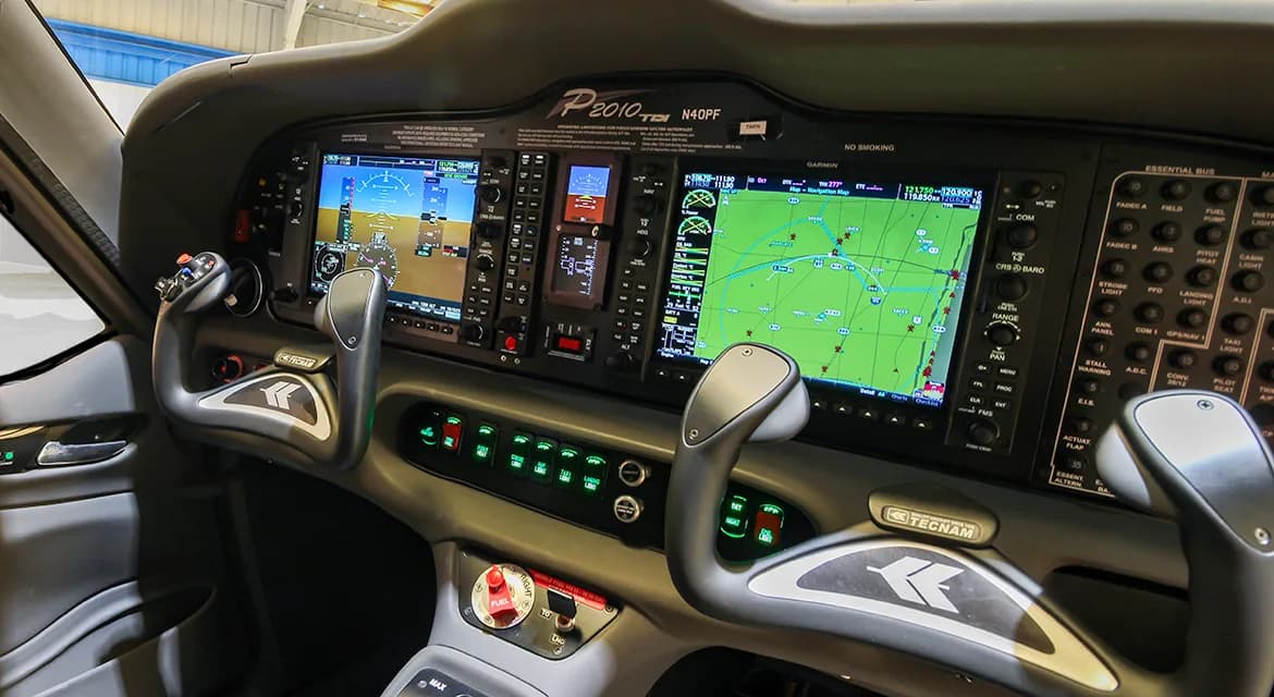 The cockpit of the Techman P2010 TDI aircraft N40PF features a modern glass panel display.