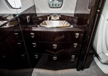 View of the aircraft lavatory sink and storage.