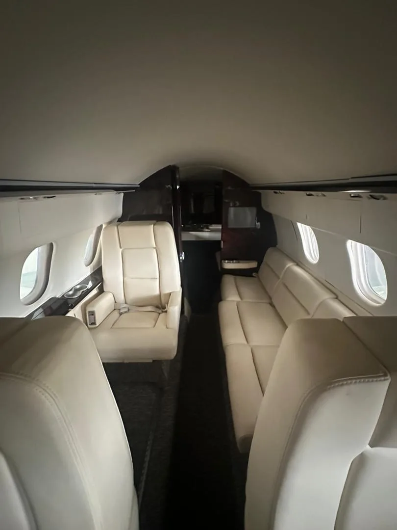 View of the cabin seats and interior of the Hawker 400XP aircraft.