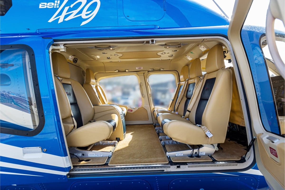 The interior of the Bell 429 helicopter with tan leather seats.