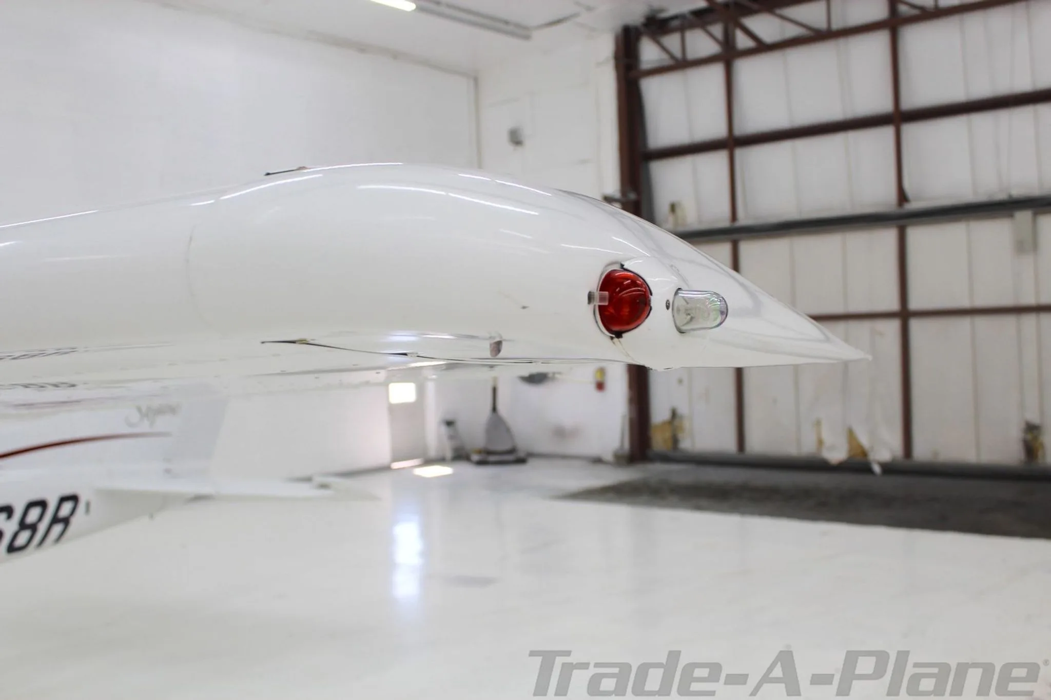 A close-up view of the wingtip with navigation lights on the Cessna Skylane N6768R.