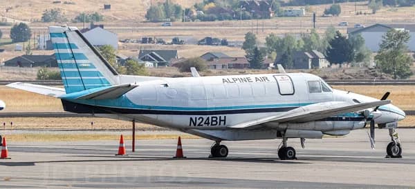 A Beechcraft King Air with 'Alpine Air' livery is parked on the tarmac.