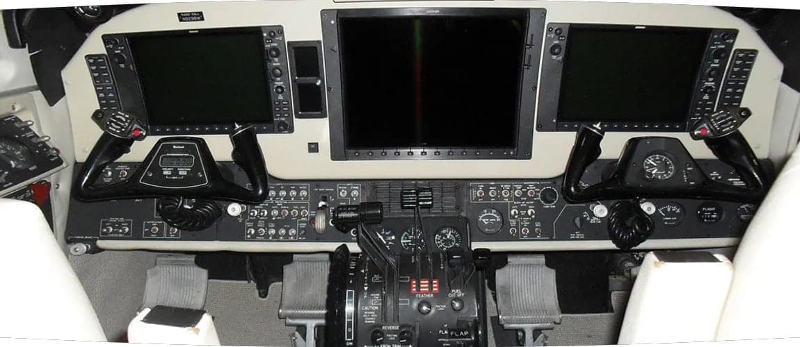 The instrument panel and controls of a King Air aircraft are shown.