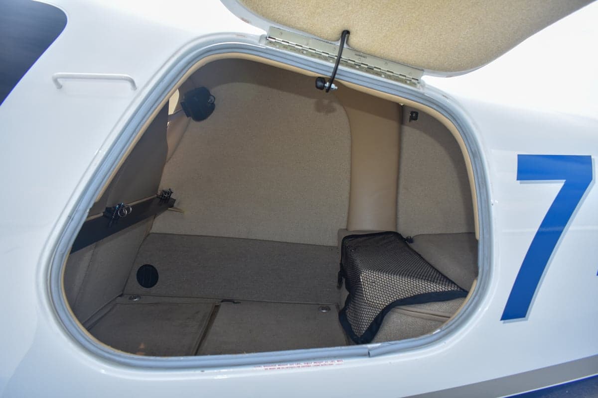 Close up of the aircraft's interior seats with seatbelts.