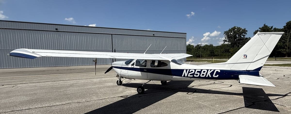 Side view of the N258KC Cessna aircraft on the ground.
