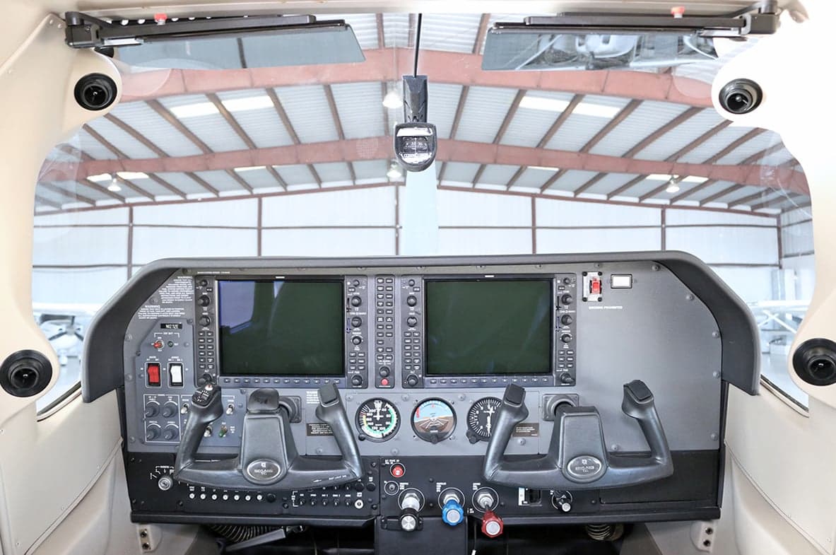 The instrument panel and controls inside the cockpit of an aircraft.