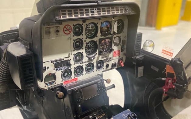 Cockpit view of the helicopter instrument panel.