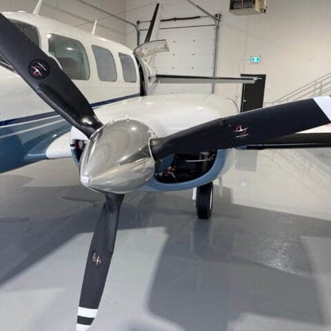 Close-up of the propeller and nose of a Piper PA-31 Navajo.
