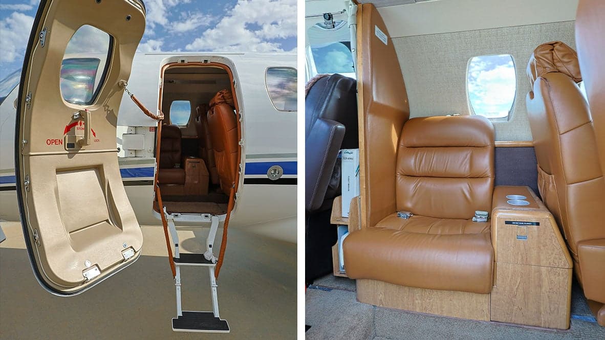 The interior of a Cessna Citation CJ1 aircraft, showing the door with airstair and leather seats.