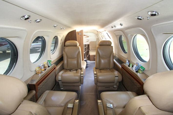 Interior view of the Beechcraft King Air 200 cabin with leather seats.