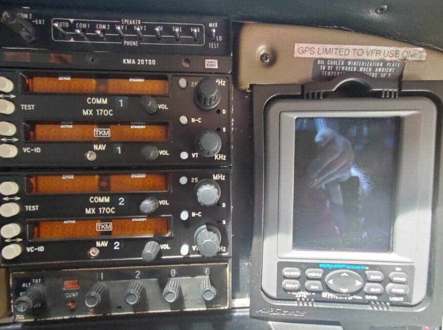 Close-up of the aircraft's radio stack and GPS unit.